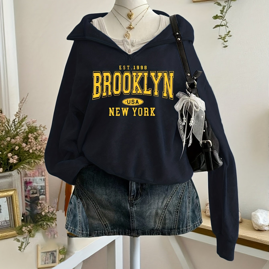 Kort sweatshirt med dragkedja, tryck och halvhög krage i mjukt material