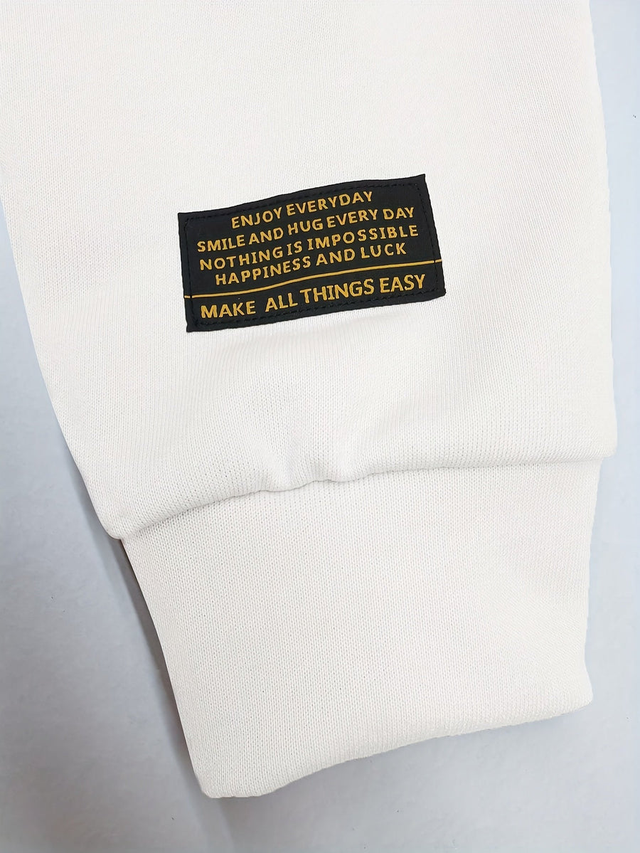 Svart T-shirt med vita långärmade ärmar och lager på lager-look