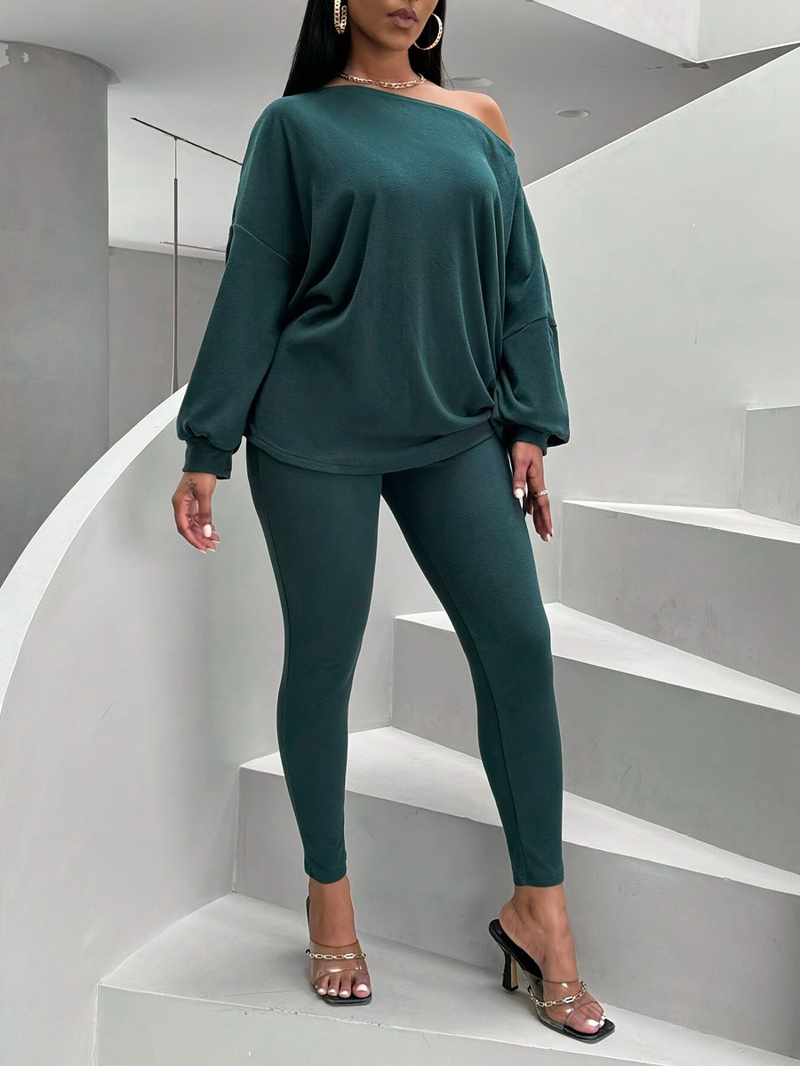 Damsset mörkgrönt med off shoulder-tröja och leggings