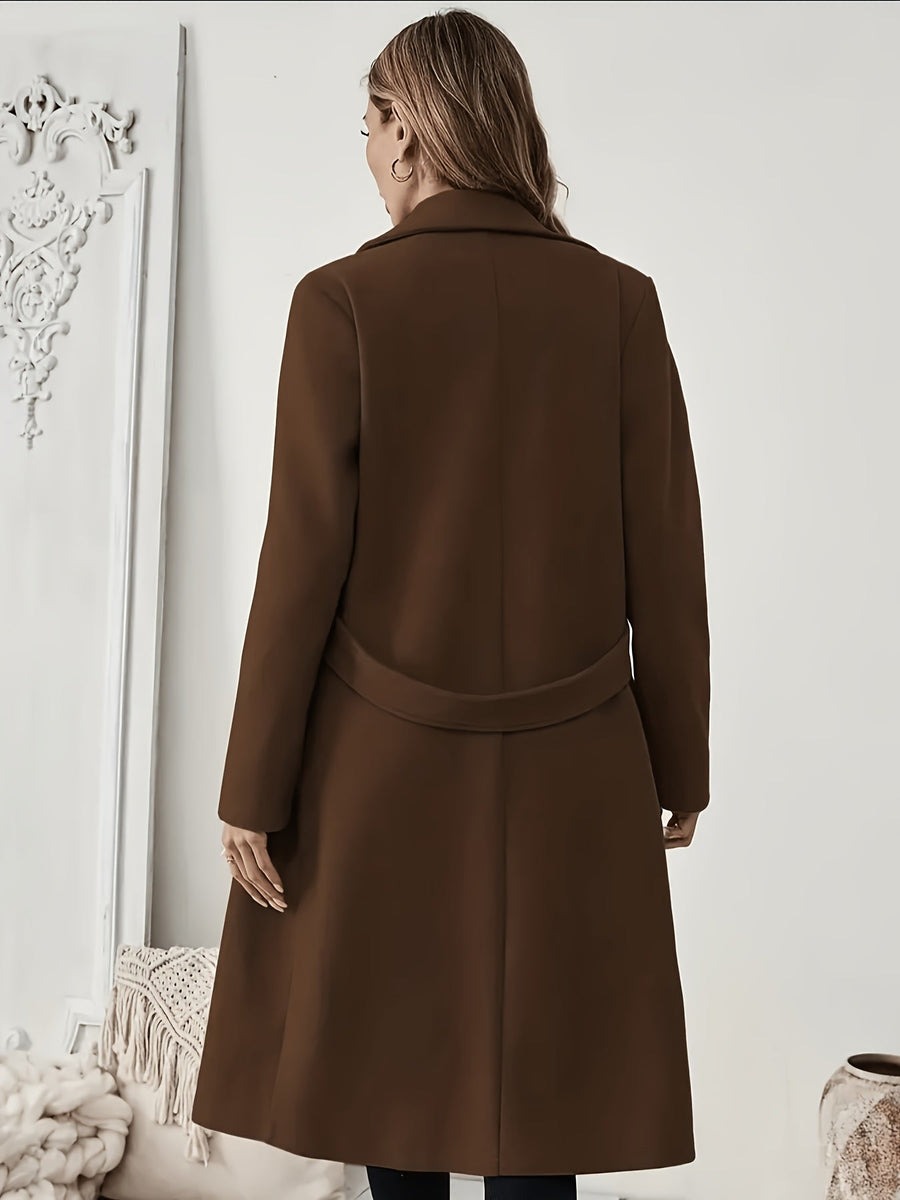 Damkappa med slag och fickor, lång modell i enfärgad design