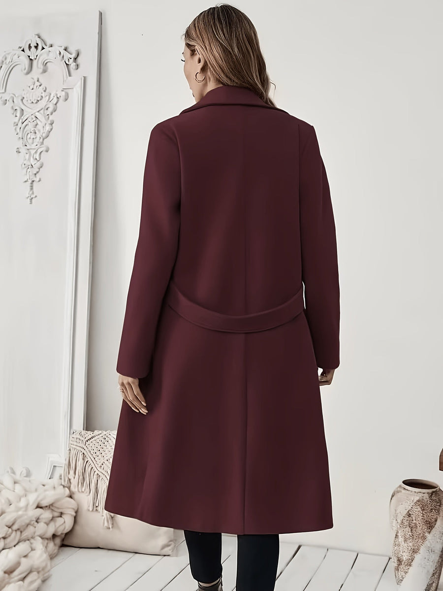 Damkappa med slag och fickor, lång modell i enfärgad design