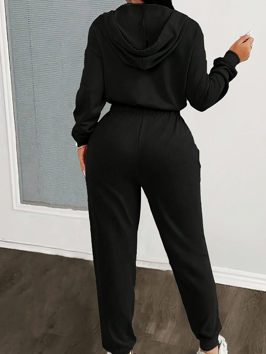 Dam jumpsuit med huva, lång dragkedja och resår i midjan - Beige