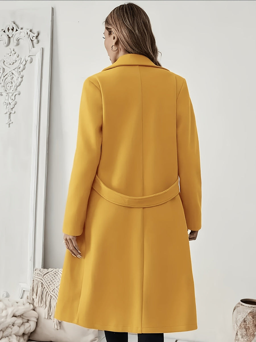 Damkappa med slag och fickor, lång modell i enfärgad design