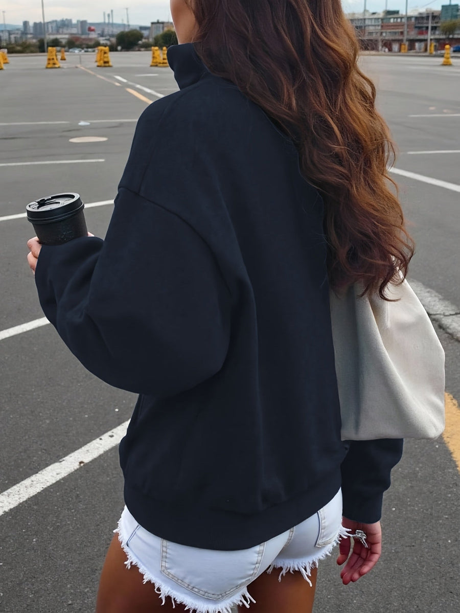 Kort sweatshirt med dragkedja, tryck och halvhög krage i mjukt material