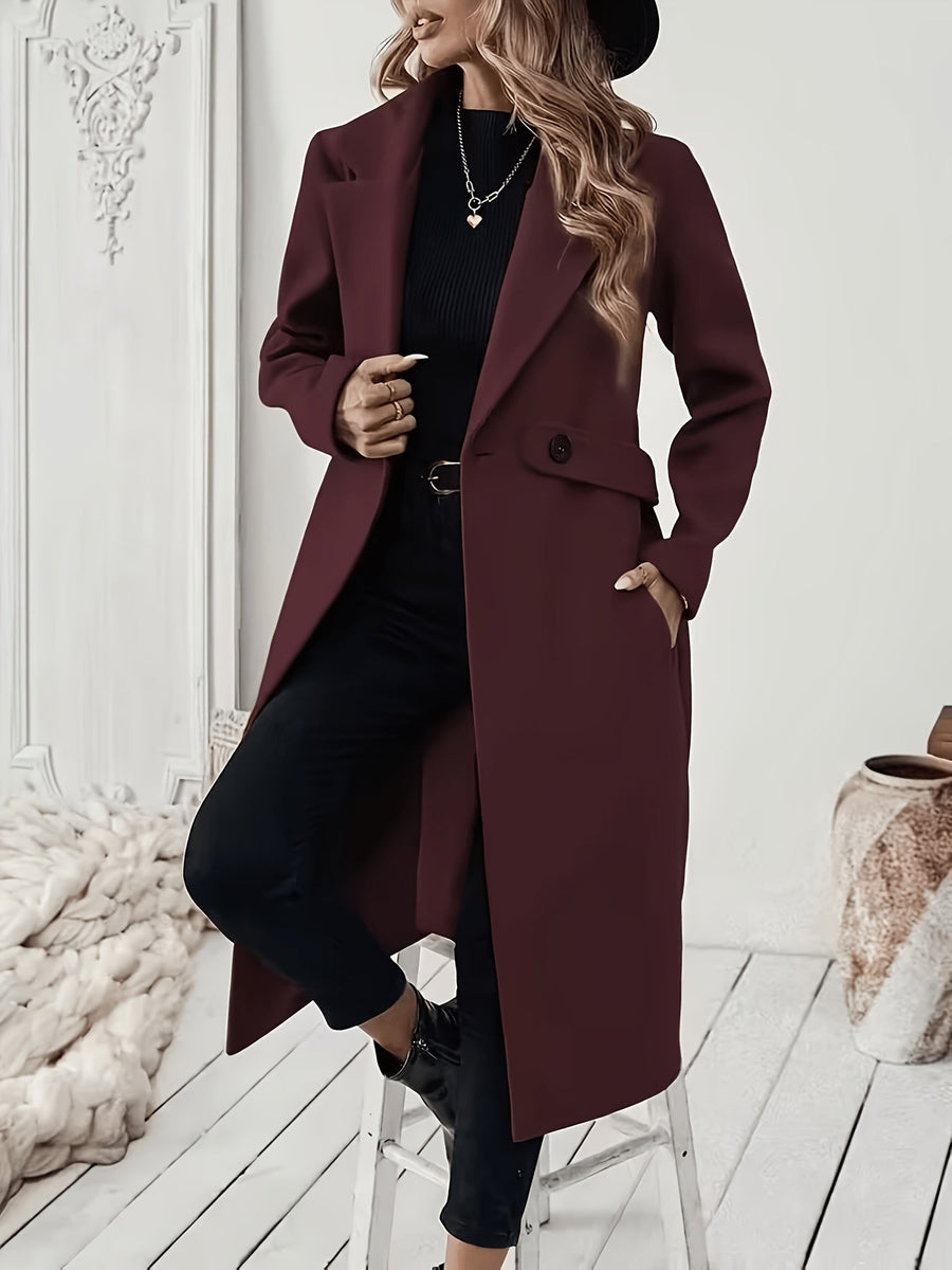 Damkappa med slag och fickor, lång modell i enfärgad design