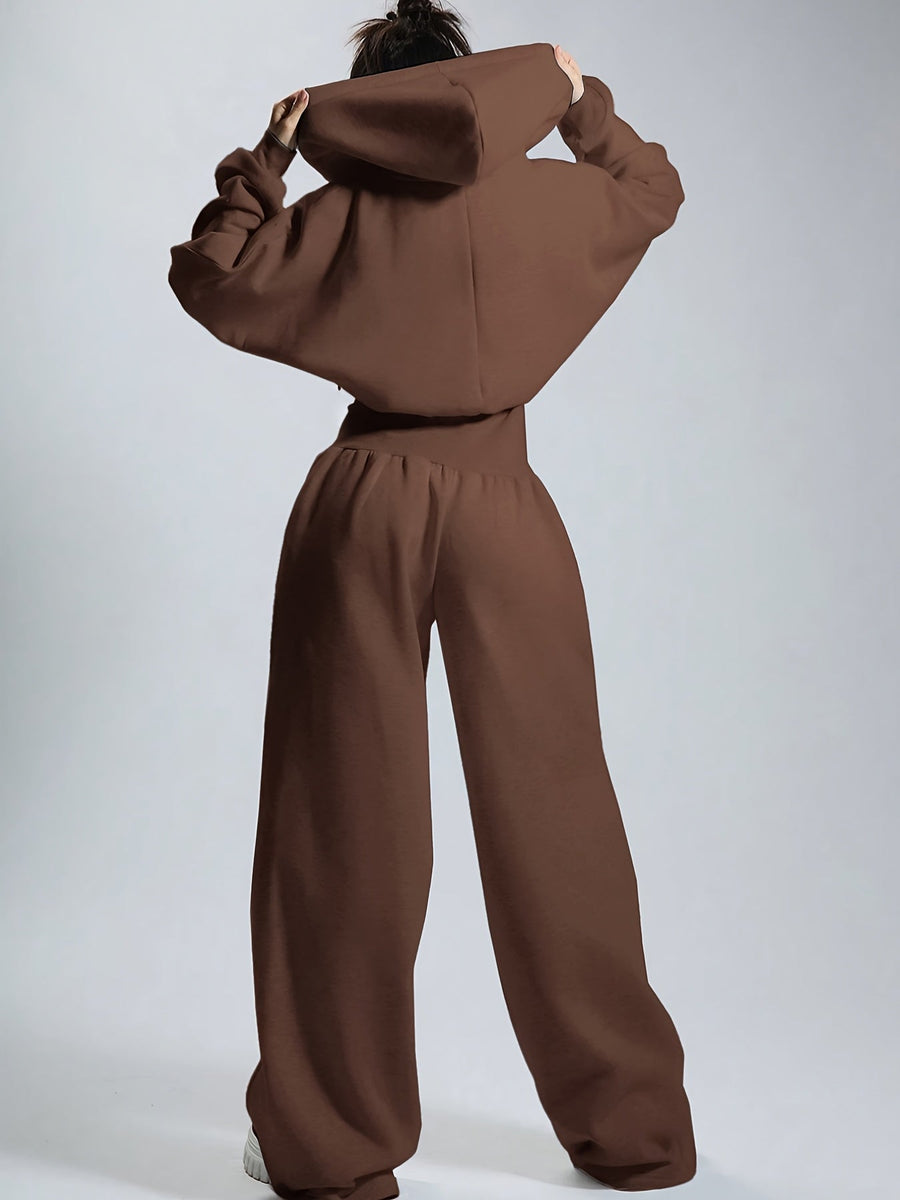 Dam jumpsuit med huva och dragkedja, vida ben