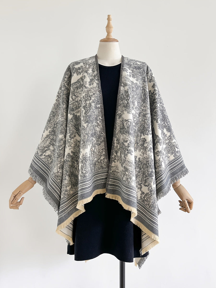 Poncho med mönster och fransar – flera färger