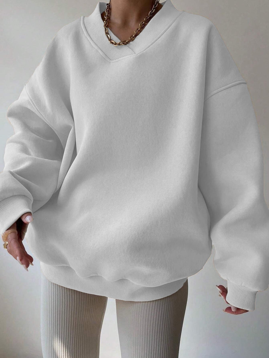 Vit Sweatshirt med V-ringning och Ribbade Detaljer