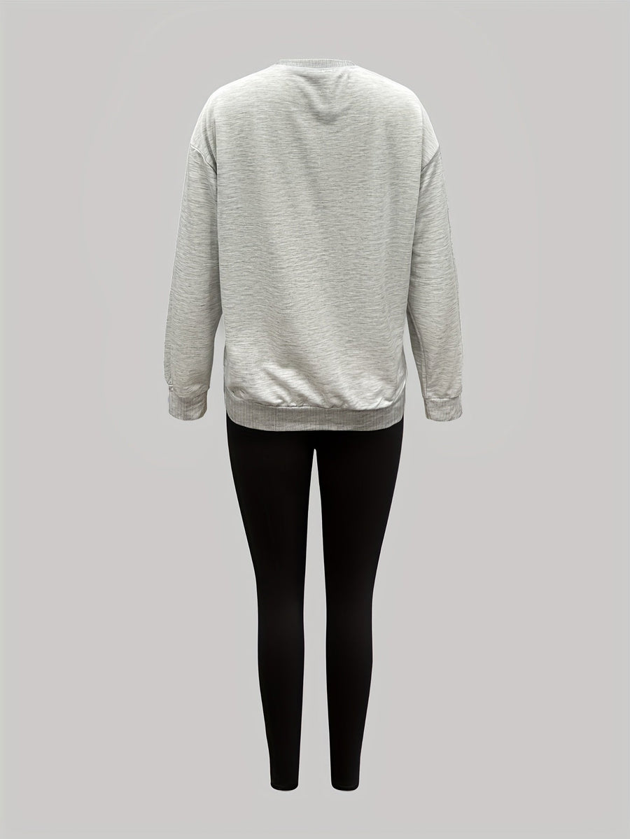 Set med sweatshirt och leggings med tassavtryck