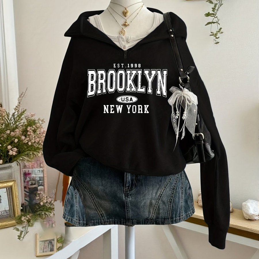 Kort sweatshirt med dragkedja, tryck och halvhög krage i mjukt material