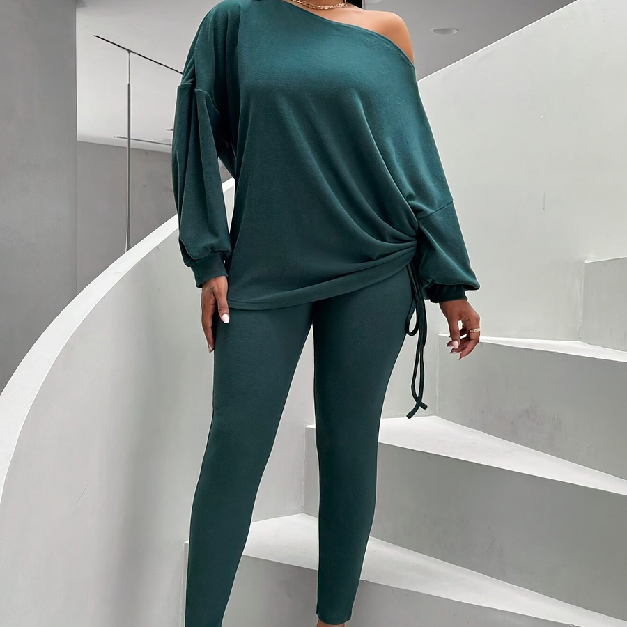 Damsset mörkgrönt med off shoulder-tröja och leggings