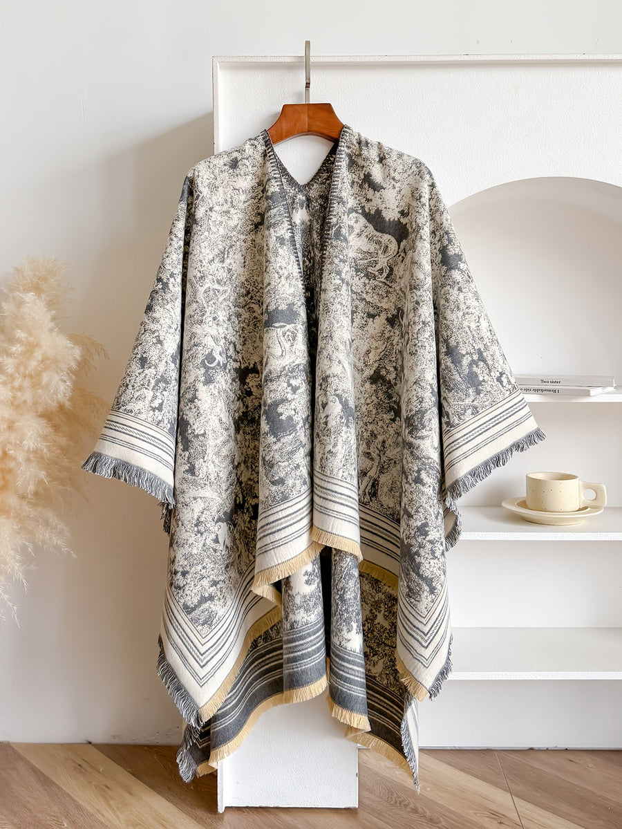 Poncho med mönster och fransar – flera färger