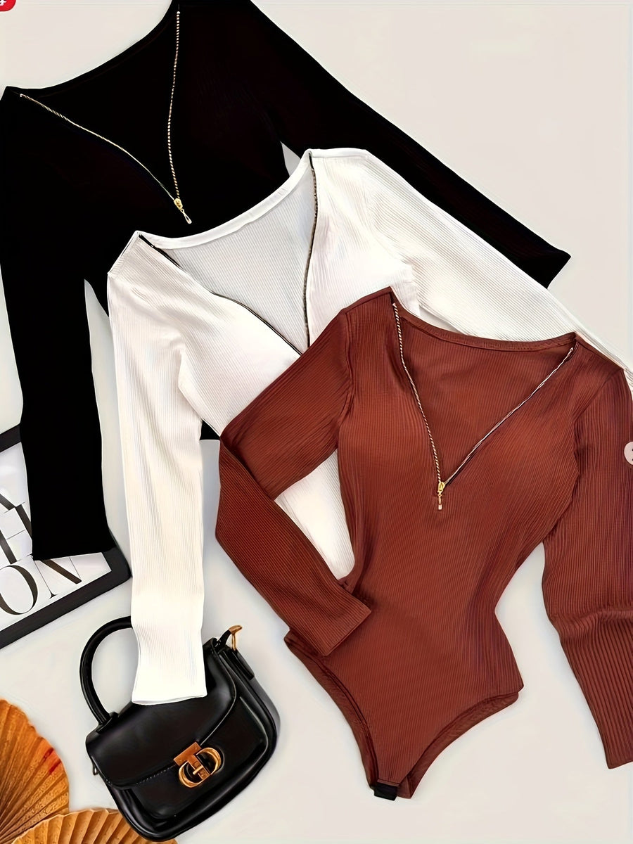 Dam bodysuit med dragkedja i ribbat material och lång ärm, flerfärgad