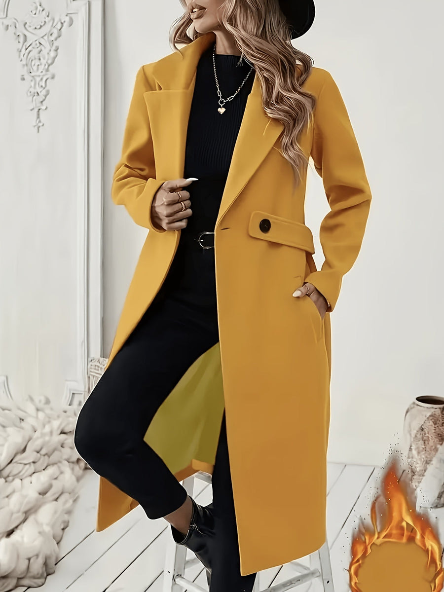 Damkappa med slag och fickor, lång modell i enfärgad design