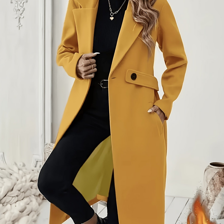 Damkappa med slag och fickor, lång modell i enfärgad design