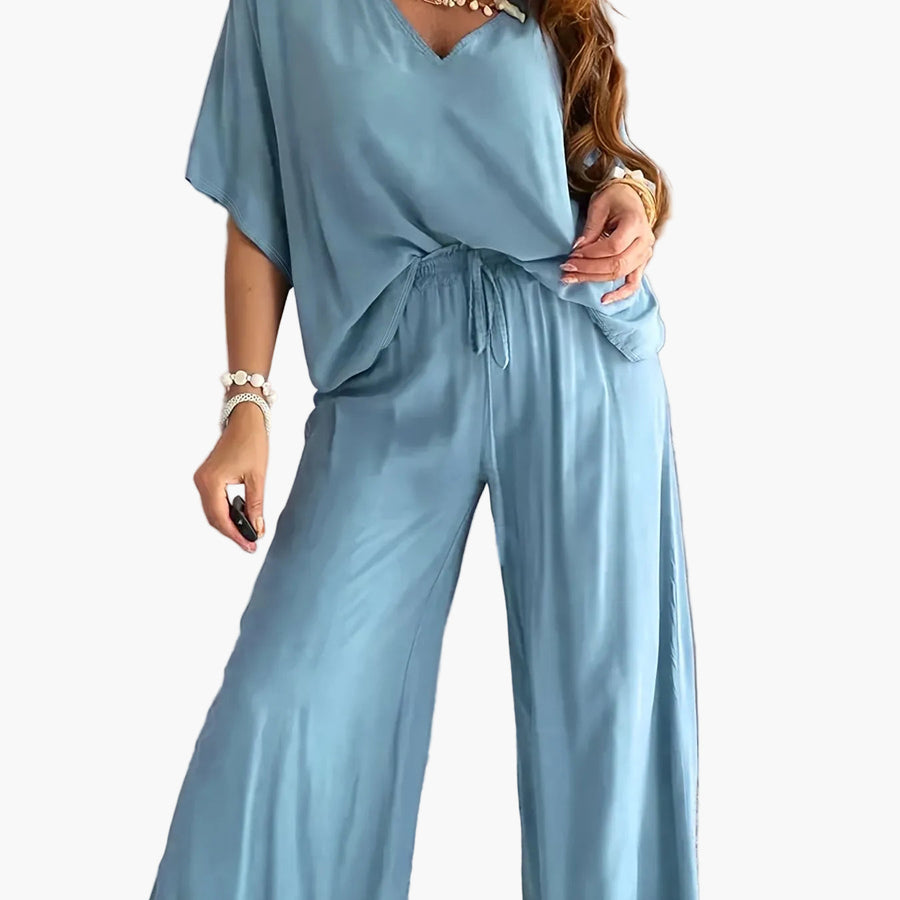 Dam Jumpsuit med V-ringning och Vida Ben – Avslappnad Sommarstil för Fritid och Semester