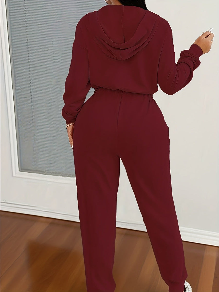 Dam jumpsuit med huva, lång dragkedja och resår i midjan - Beige