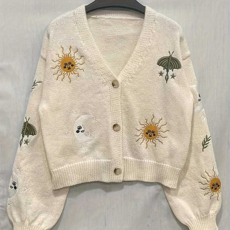 Stickad kofta med V-ringning och broderade sol- och månmotiv, flera färger