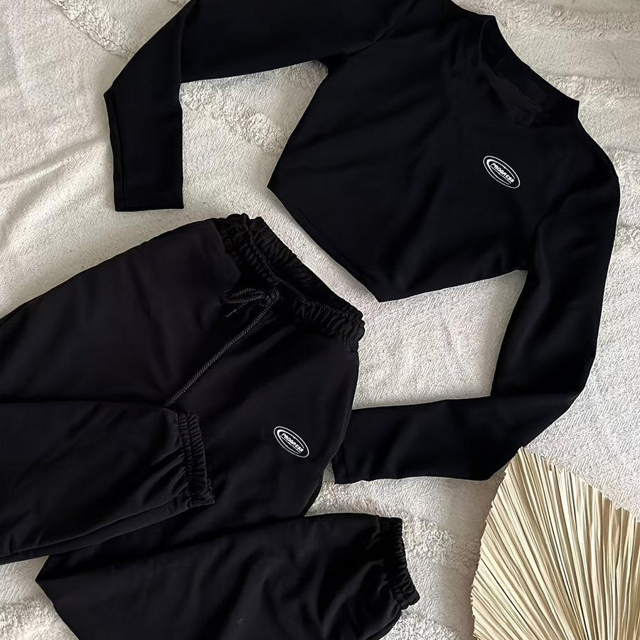 Svart träningsset med croptop och sweatpants för dam