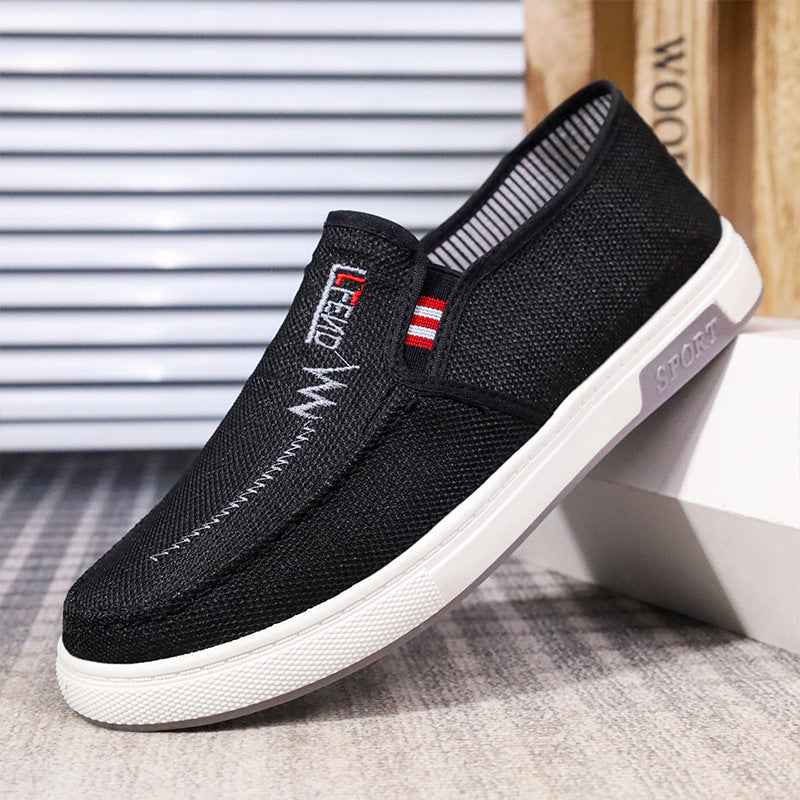 Slip-on skor för herr med sportig design och broderad detalj