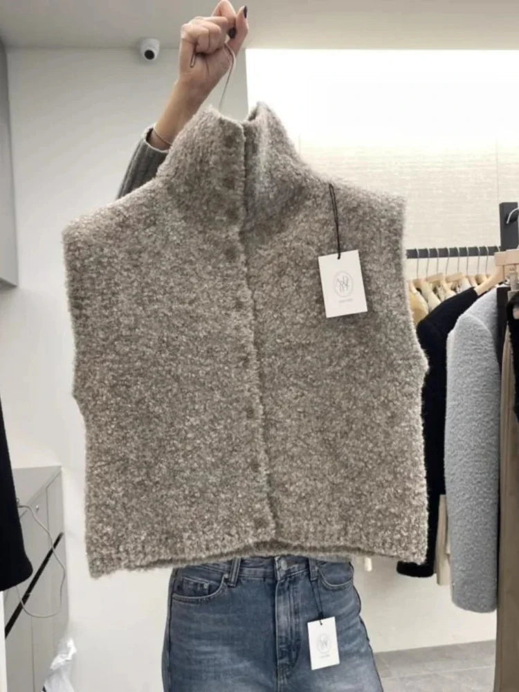 Teddyväst för dam i bouclé med hög krage och knappar