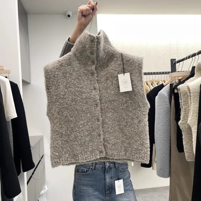 Teddyväst för dam i bouclé med hög krage och knappar
