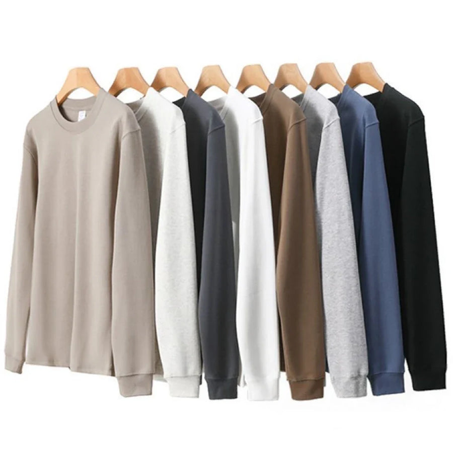 Enkel enfärgad sweatshirt med rund hals och lång ärm