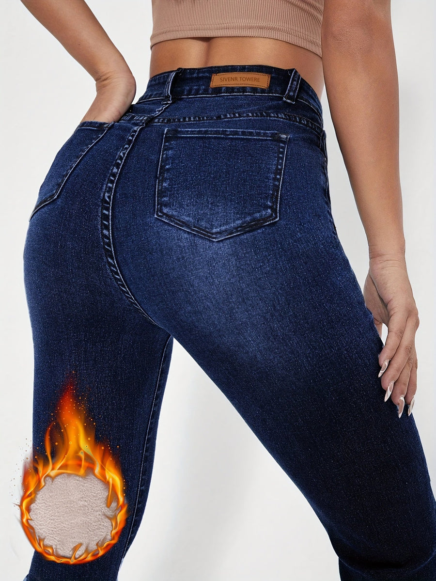 Mörkblå Högmidjade Utställda Jeans med Foder
