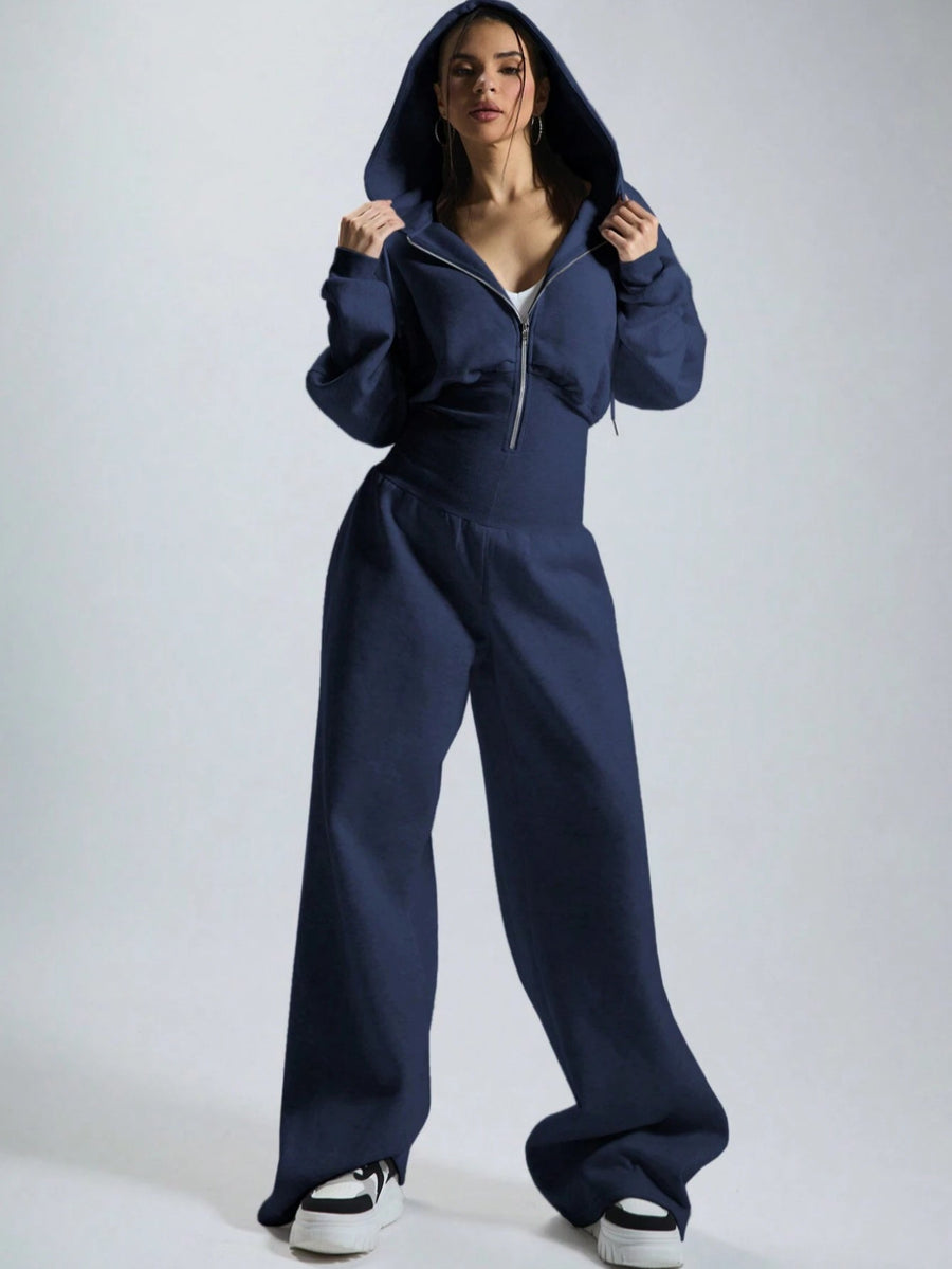 Dam jumpsuit med huva och dragkedja, vida ben