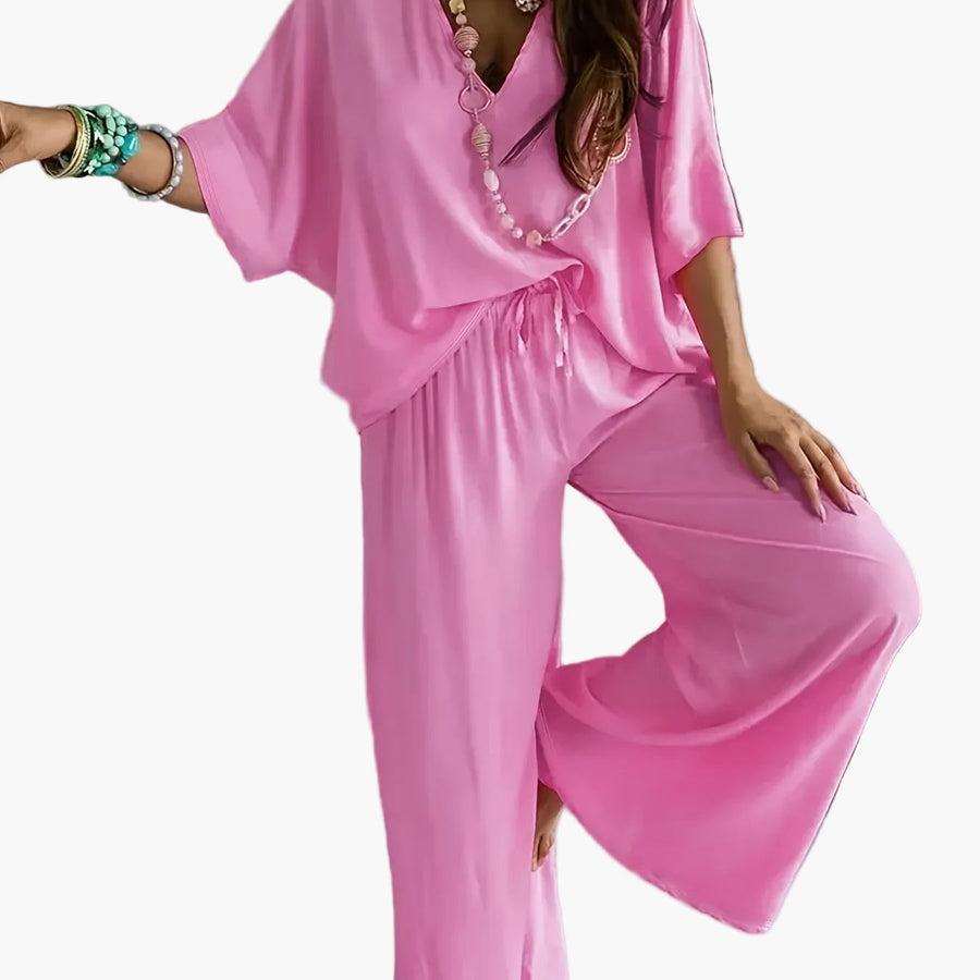 Dam Jumpsuit med V-ringning och Vida Ben – Avslappnad Sommarstil för Fritid och Semester