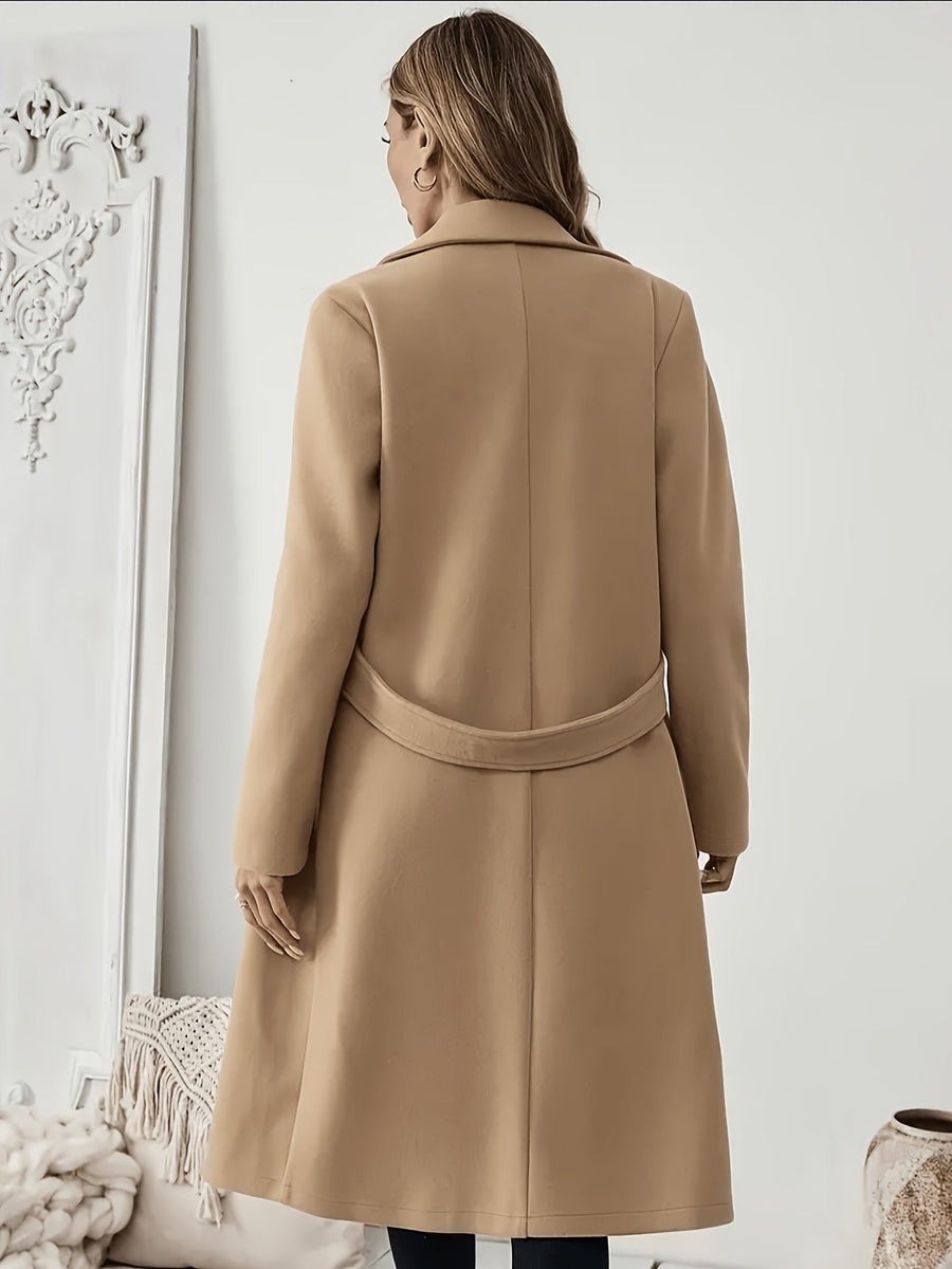 Damkappa med slag och fickor, lång modell i enfärgad design