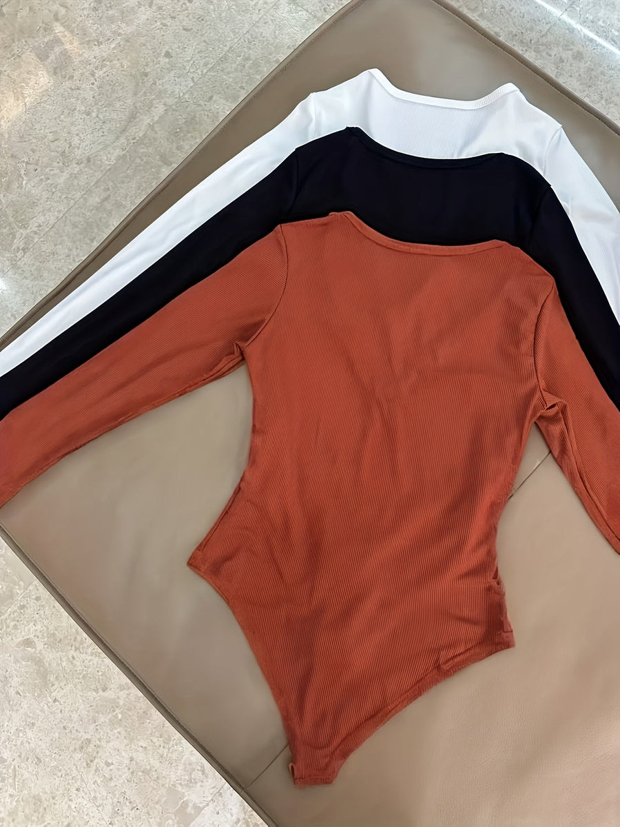 Dam bodysuit med dragkedja i ribbat material och lång ärm, flerfärgad