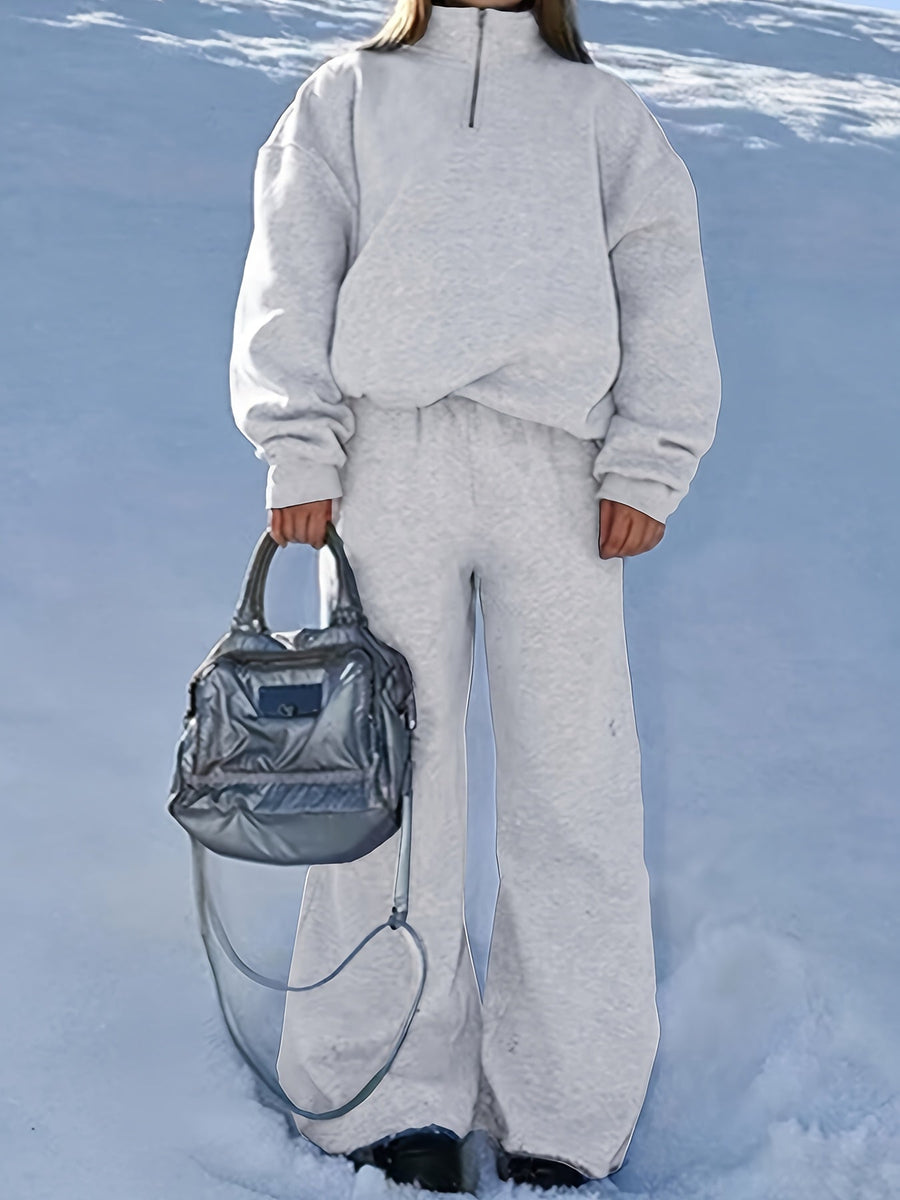 Dam sweatsuit med halv dragkedja, långärmad tröja och matchande byxor i mjukt material