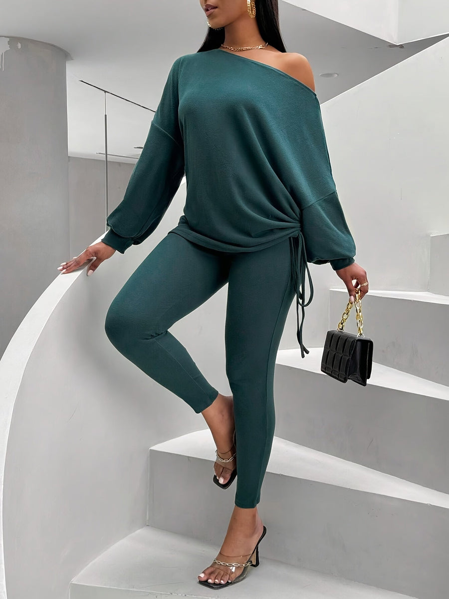 Damsset mörkgrönt med off shoulder-tröja och leggings