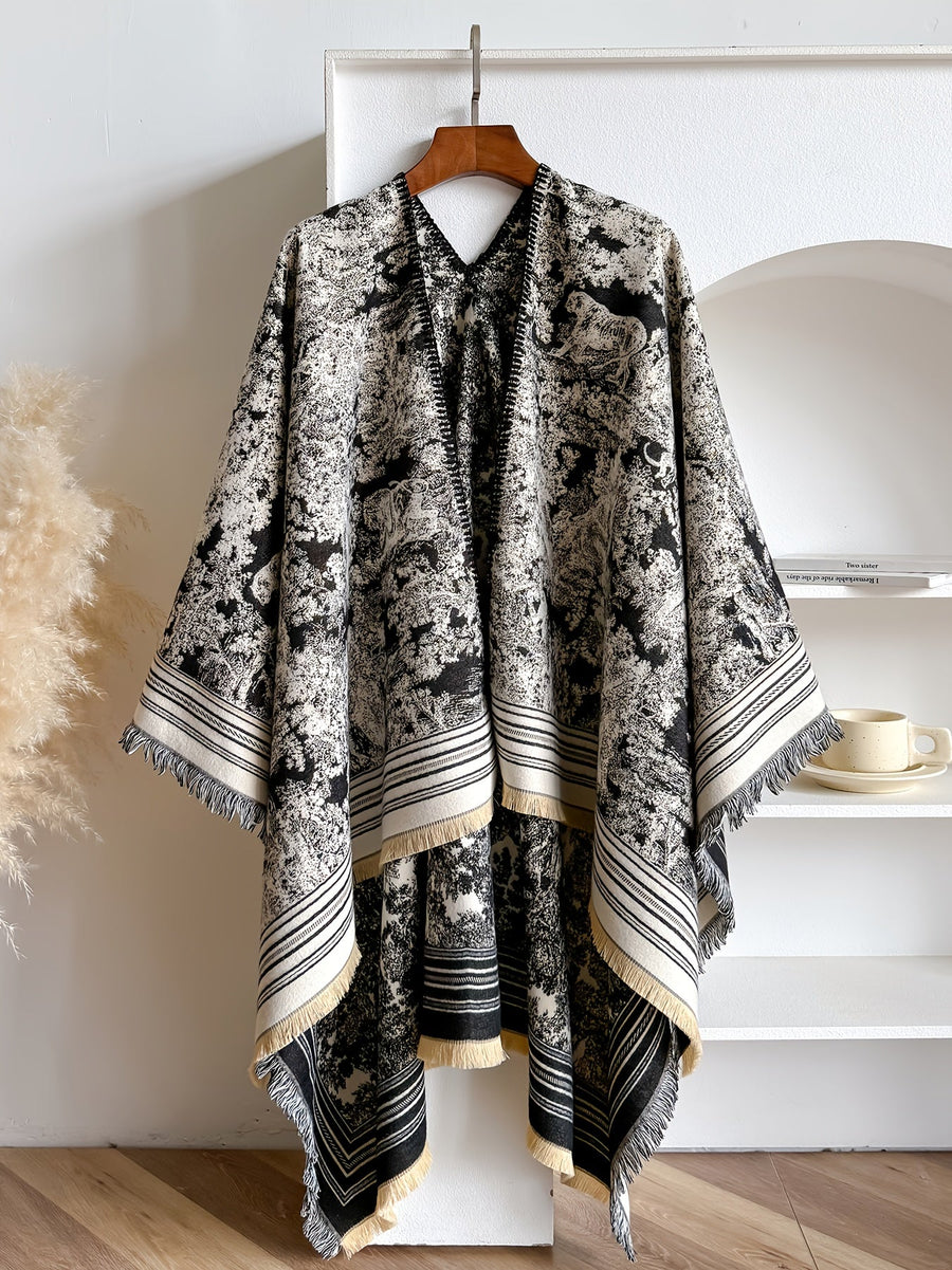 Poncho med mönster och fransar – flera färger