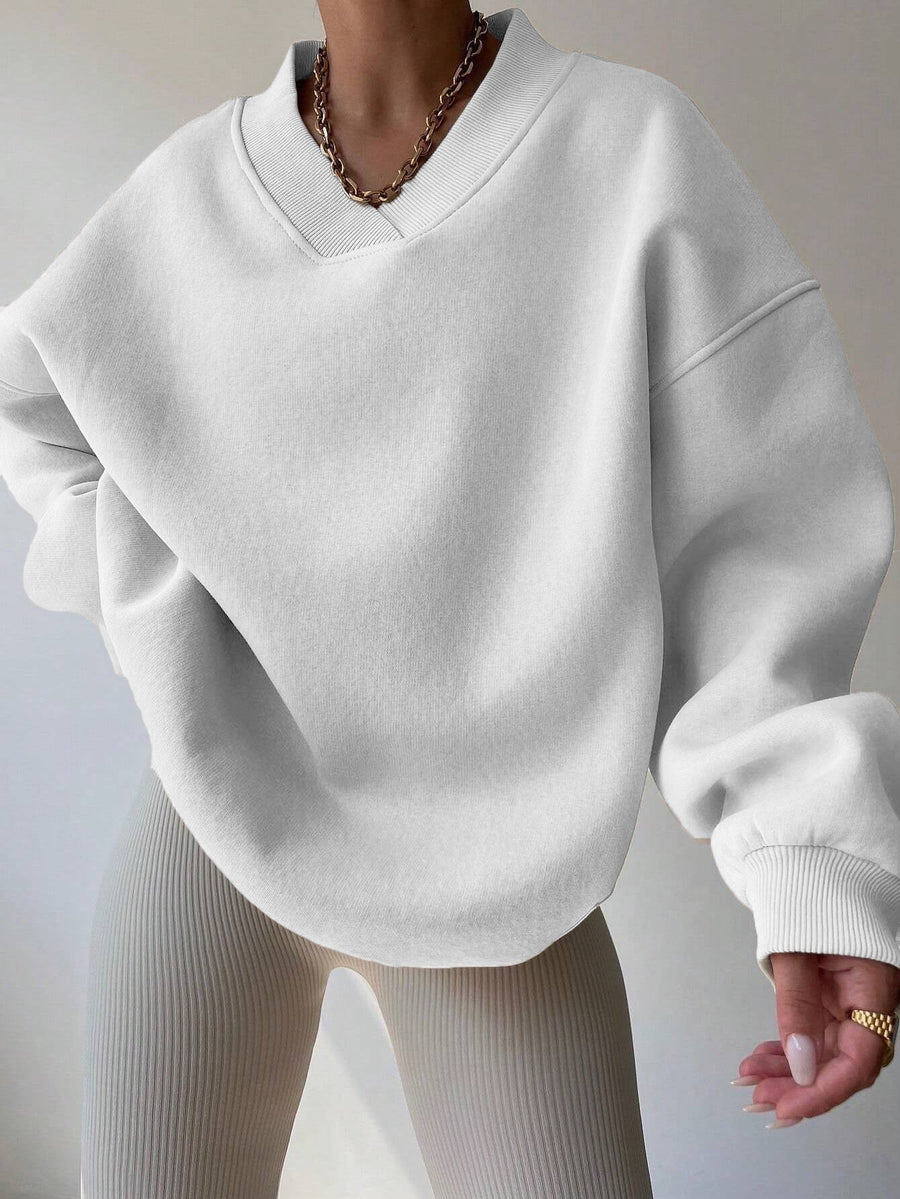 Vit Sweatshirt med V-ringning och Ribbade Detaljer