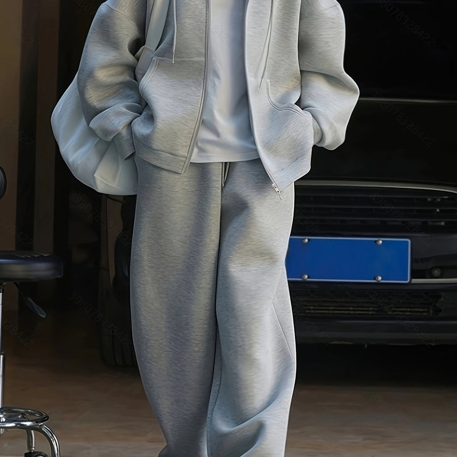 Grå hoodie-set med dragkedja och vida byxor, avslappnad passform