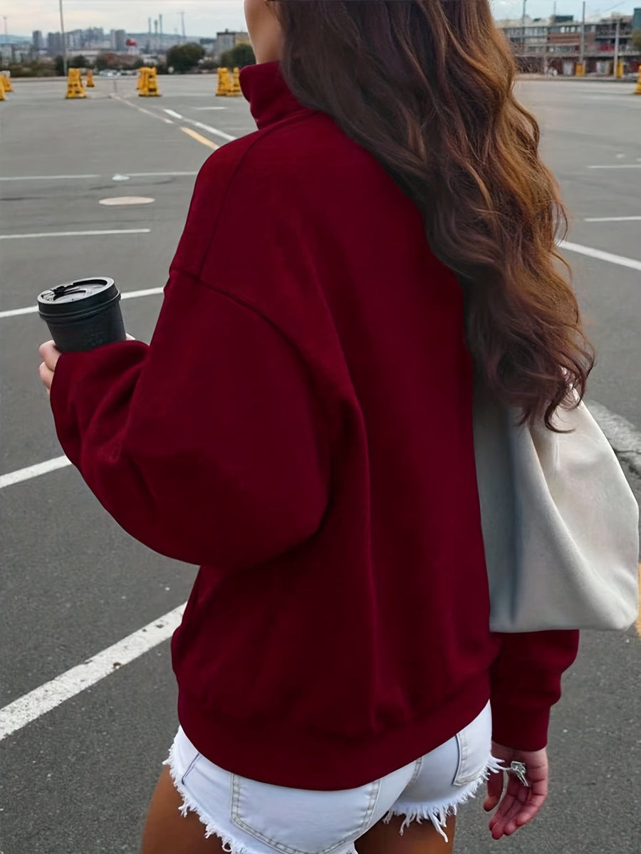Kort sweatshirt med dragkedja, tryck och halvhög krage i mjukt material