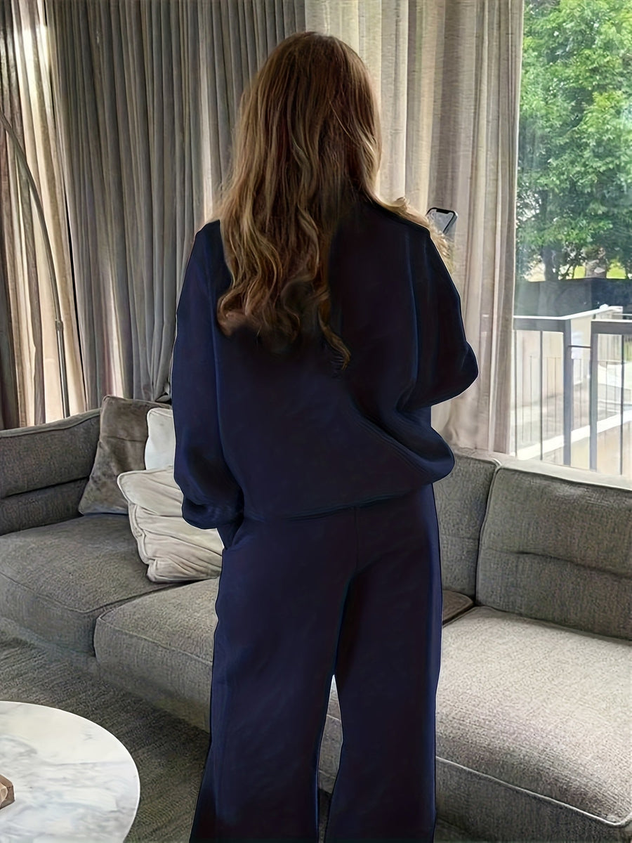 Dam sweatsuit med halv dragkedja, långärmad tröja och matchande byxor i mjukt material