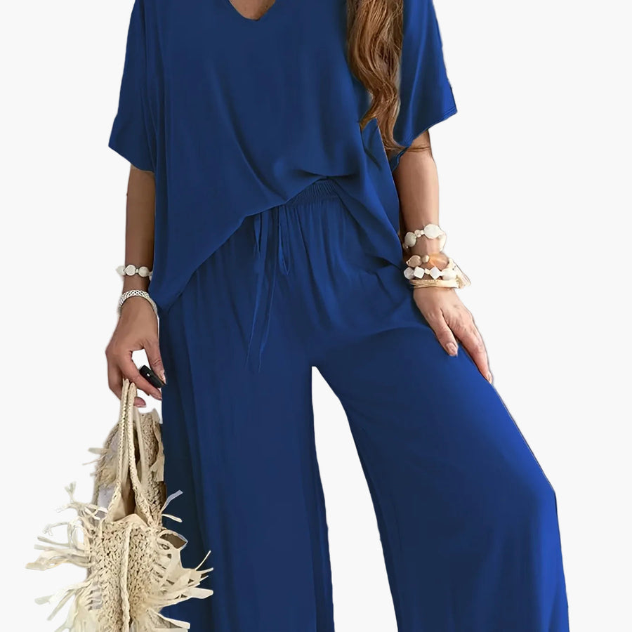 Dam Jumpsuit med V-ringning och Vida Ben – Avslappnad Sommarstil för Fritid och Semester