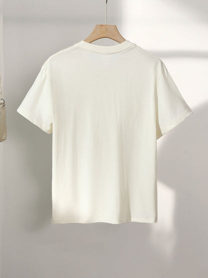 Dam T-shirt med vintage skeppstryck – casual nautisk stil