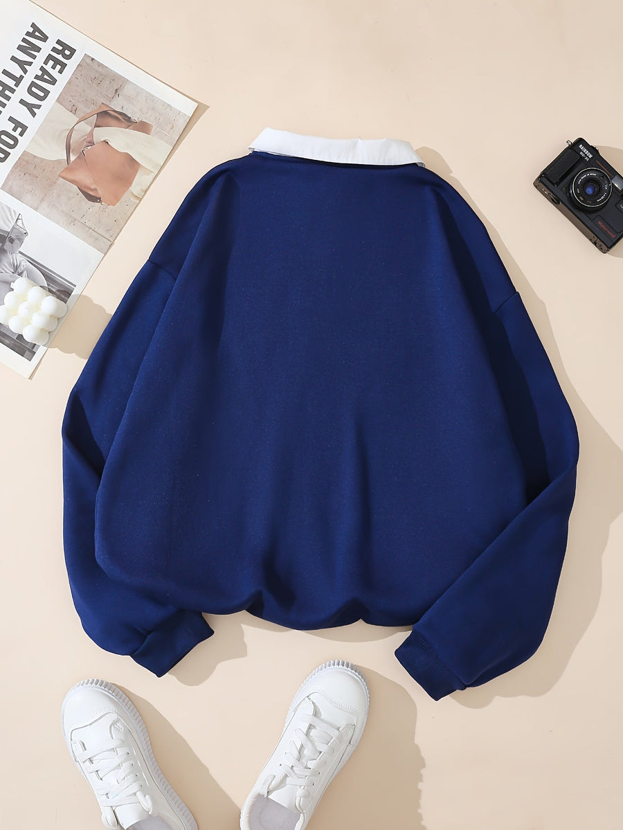Marinblå college sweatshirt med krage och New York-text