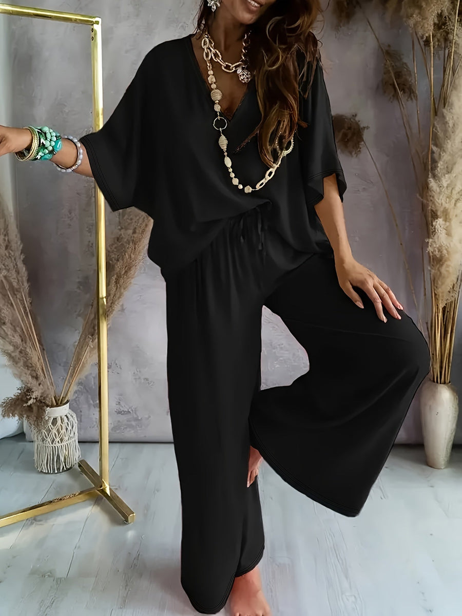 Dam Jumpsuit med V-ringning och Vida Ben – Avslappnad Sommarstil för Fritid och Semester