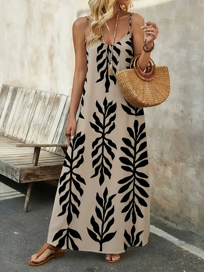 Damklänning i boho-stil med maxilängd och botaniskt bladmönster – perfekt för sommar och semester