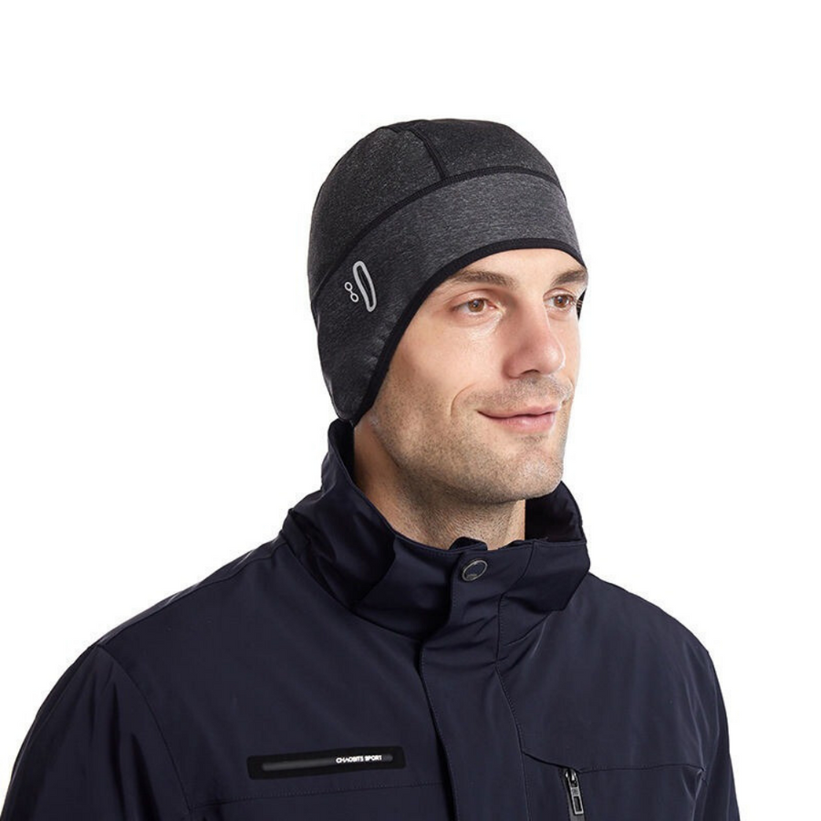 Träningsmössa med öronlappar och reflexdetalj