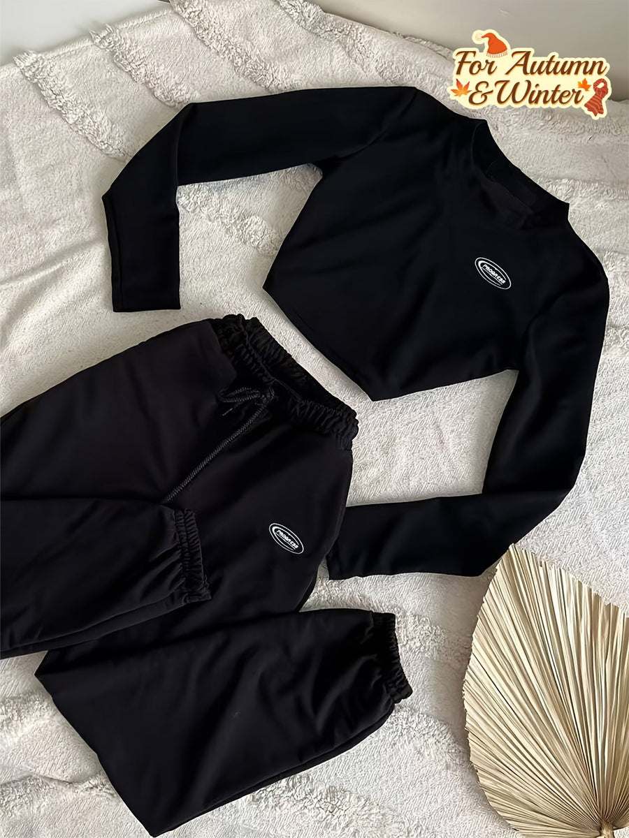 Svart träningsset med croptop och sweatpants för dam