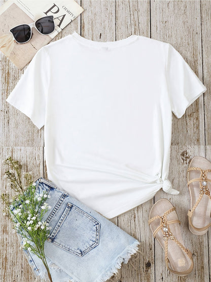 Dam T-shirt med blommigt och fjädertryck, avslappnad stil, perfekt för vardagsbruk