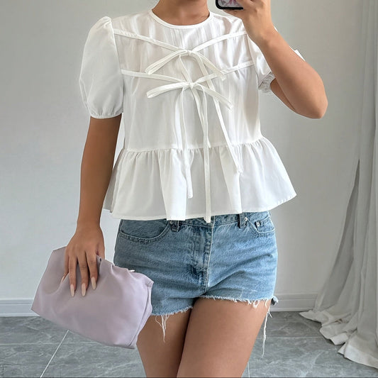 Dam Peplum Blus med Puffärmar och Rosett-detaljer – Romantisk och Modern Top för Vardag och Fritid
