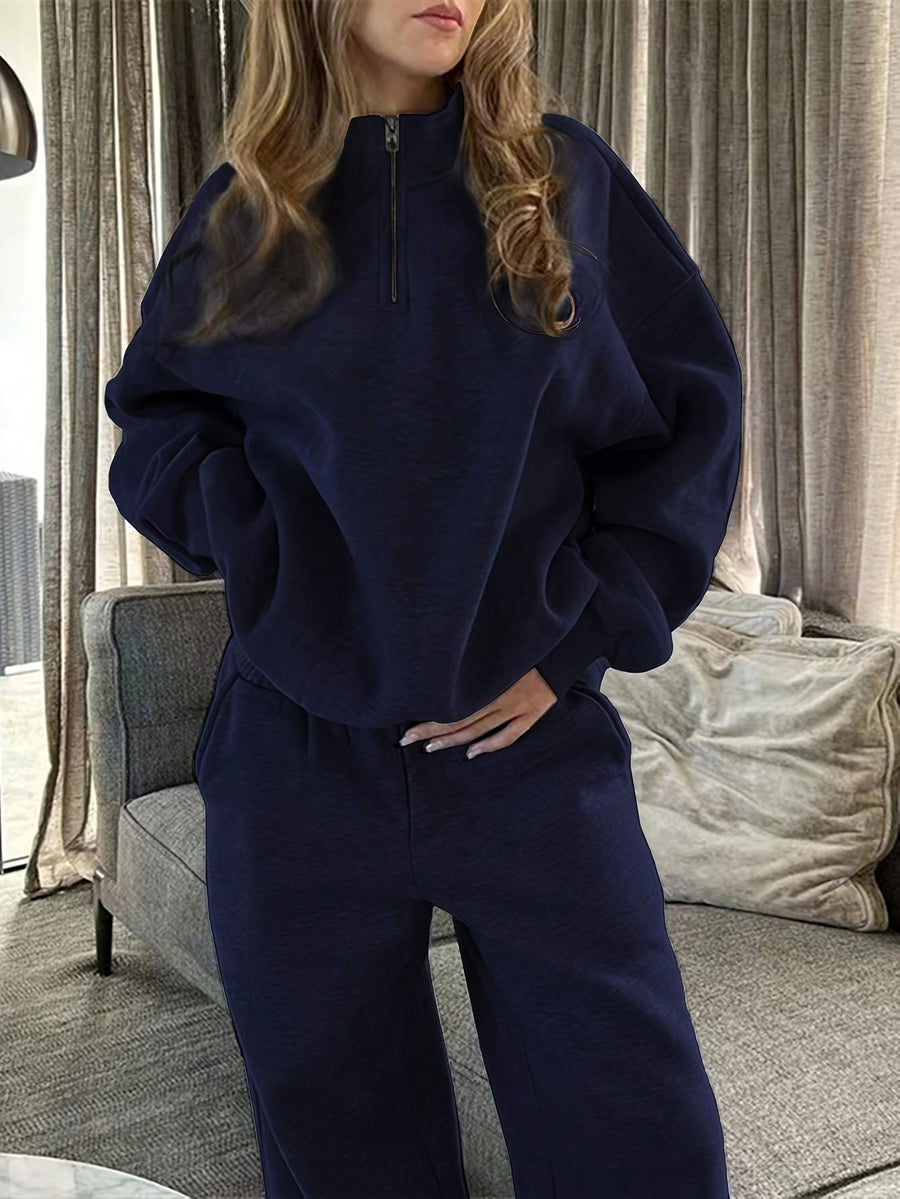 Dam sweatsuit med halv dragkedja, långärmad tröja och matchande byxor i mjukt material