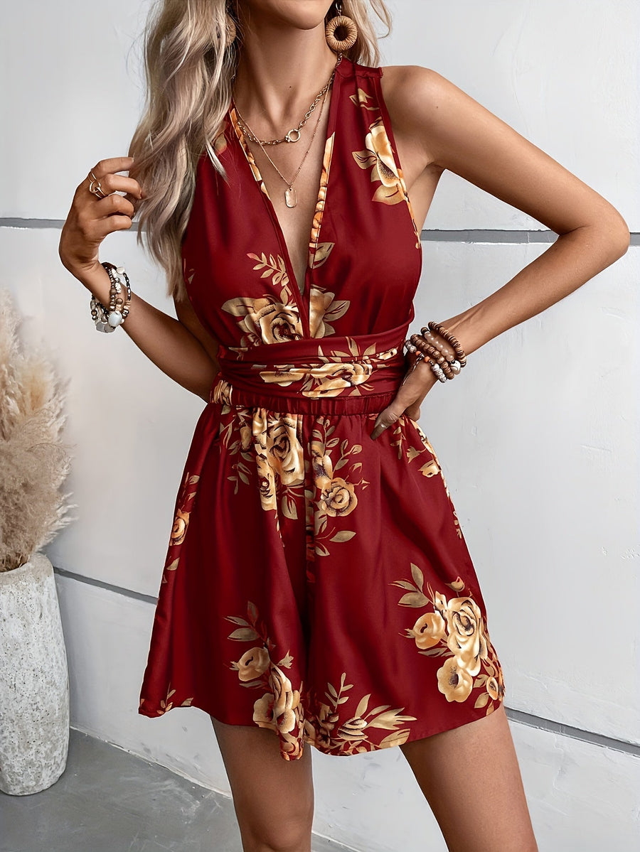 Dam Playsuit med Djup V-ringning och Blommigt Mönster – Elegant och Trendig Jumpsuit för Fritid och Fest